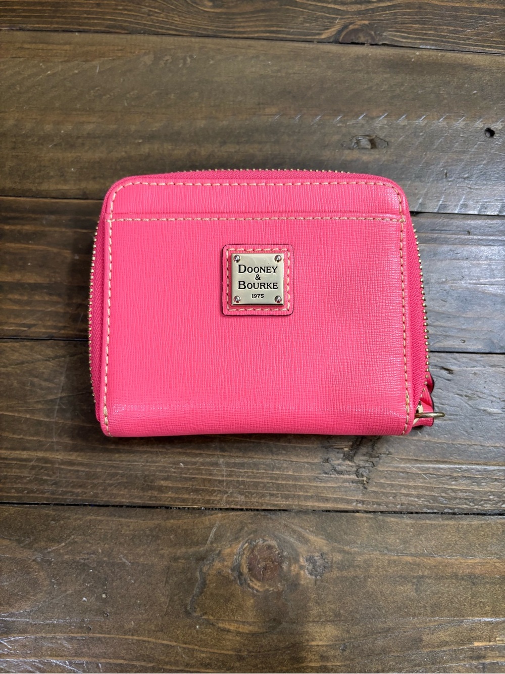 Dooney & Bourke Pebble Grain Small Zip Around Wallet in “Bubblegum Pink”